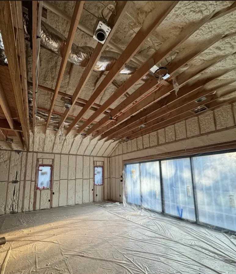 Interior walls and ceiling insulated with spray foam during new construction in East Buffalo